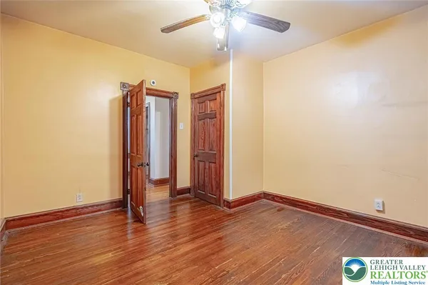 a view of entryway with wooden floor