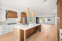 8 Orchard Road, Unit B Gloucester, MA 01930 - Photo 7 of 8 a kitchen with a sink stove and cabinets