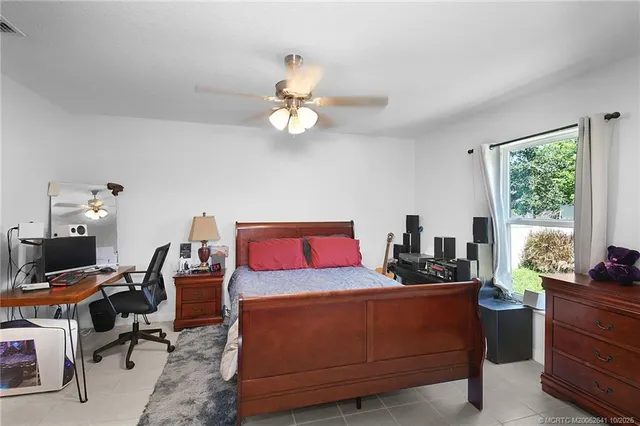 a bedroom with a workspace