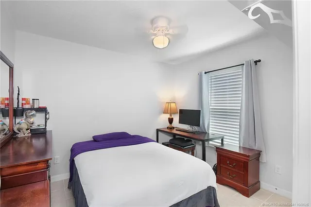 a bedroom with a bed and a desk