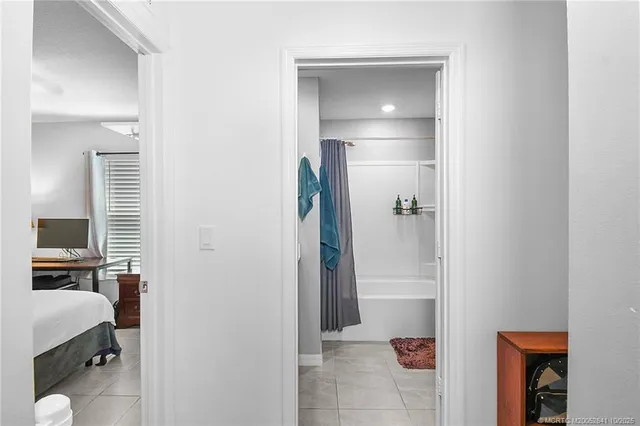 a bathroom with a walk in closet and a bathroom