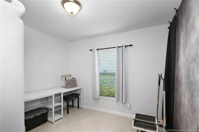 a room with furniture and a window