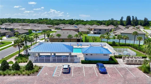 an aerial view of multiple houses with yard