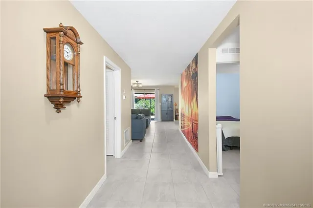 a view of a hallway with wooden shelves