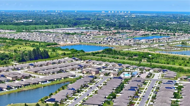 a front view of a house with a garden and a yard