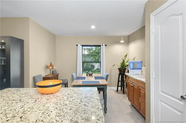 a living room with furniture a window and a table