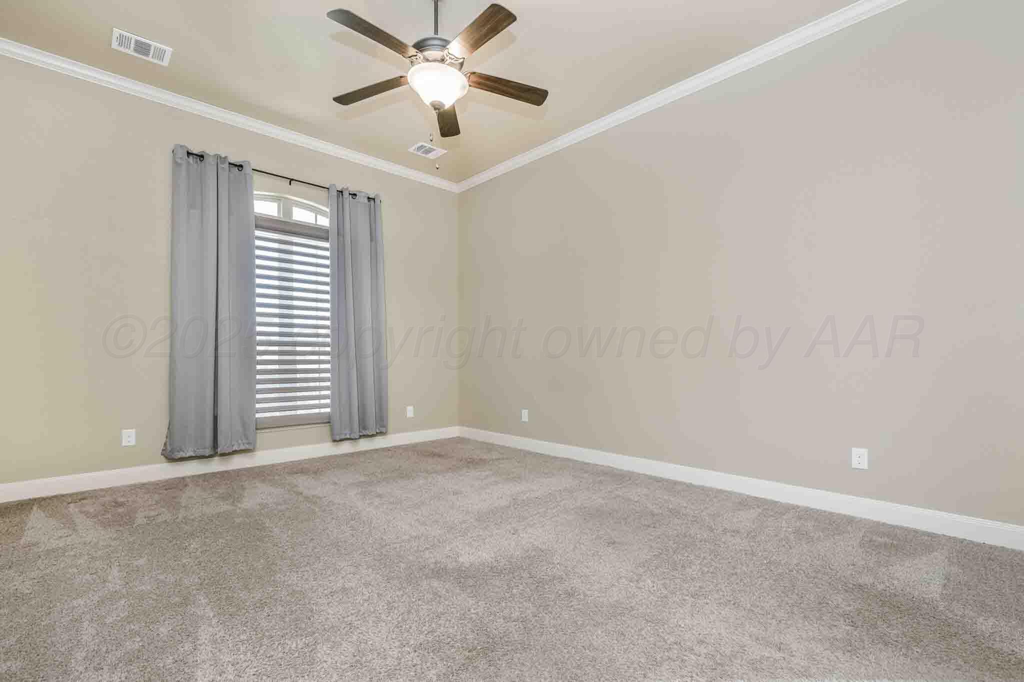 6 Cody Lane Canyon, TX 79015 - Photo 14 of 23 an empty room with windows and fan chandelier fan