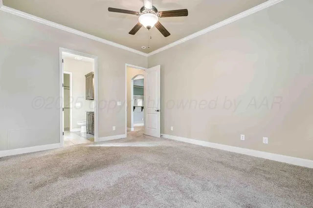 a view of empty room with window and a ceiling fan