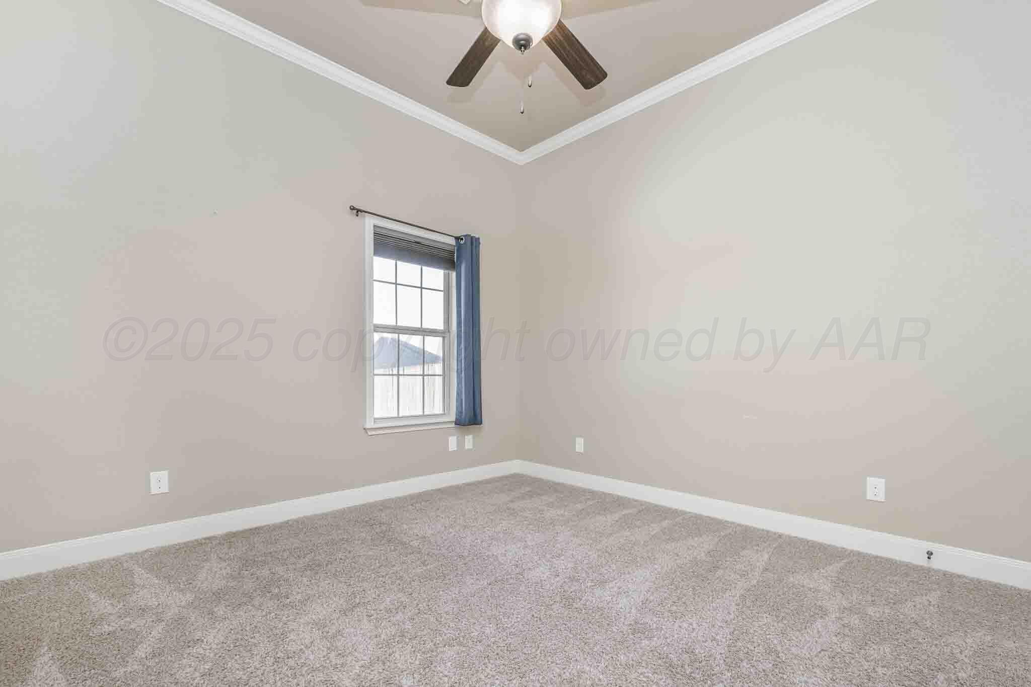 6 Cody Lane Canyon, TX 79015 - Photo 18 of 23 an empty room with a window and a ceiling fan