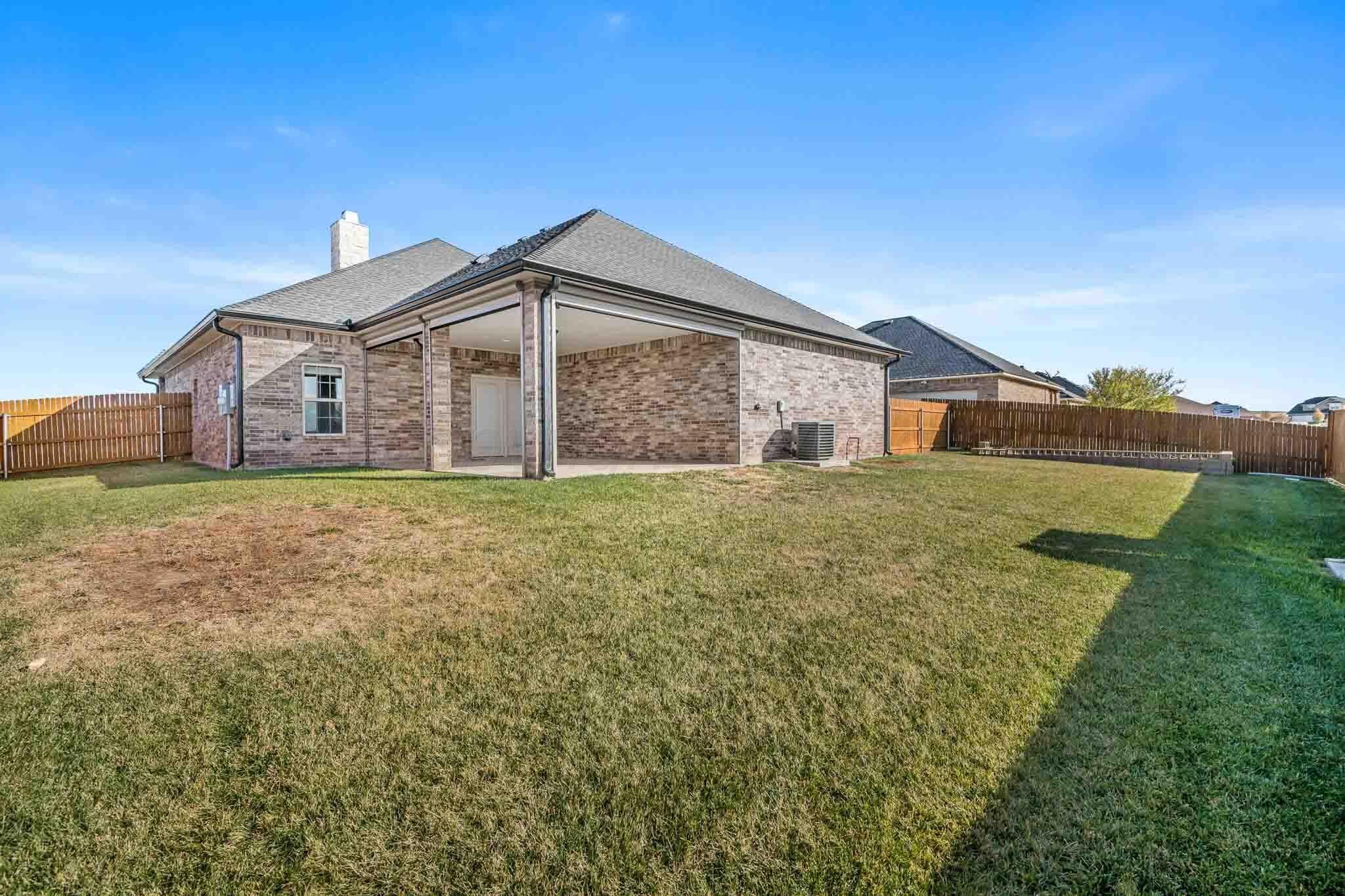 6 Cody Lane Canyon, TX 79015 - Photo 22 of 23 a big white house with a big yard and large trees