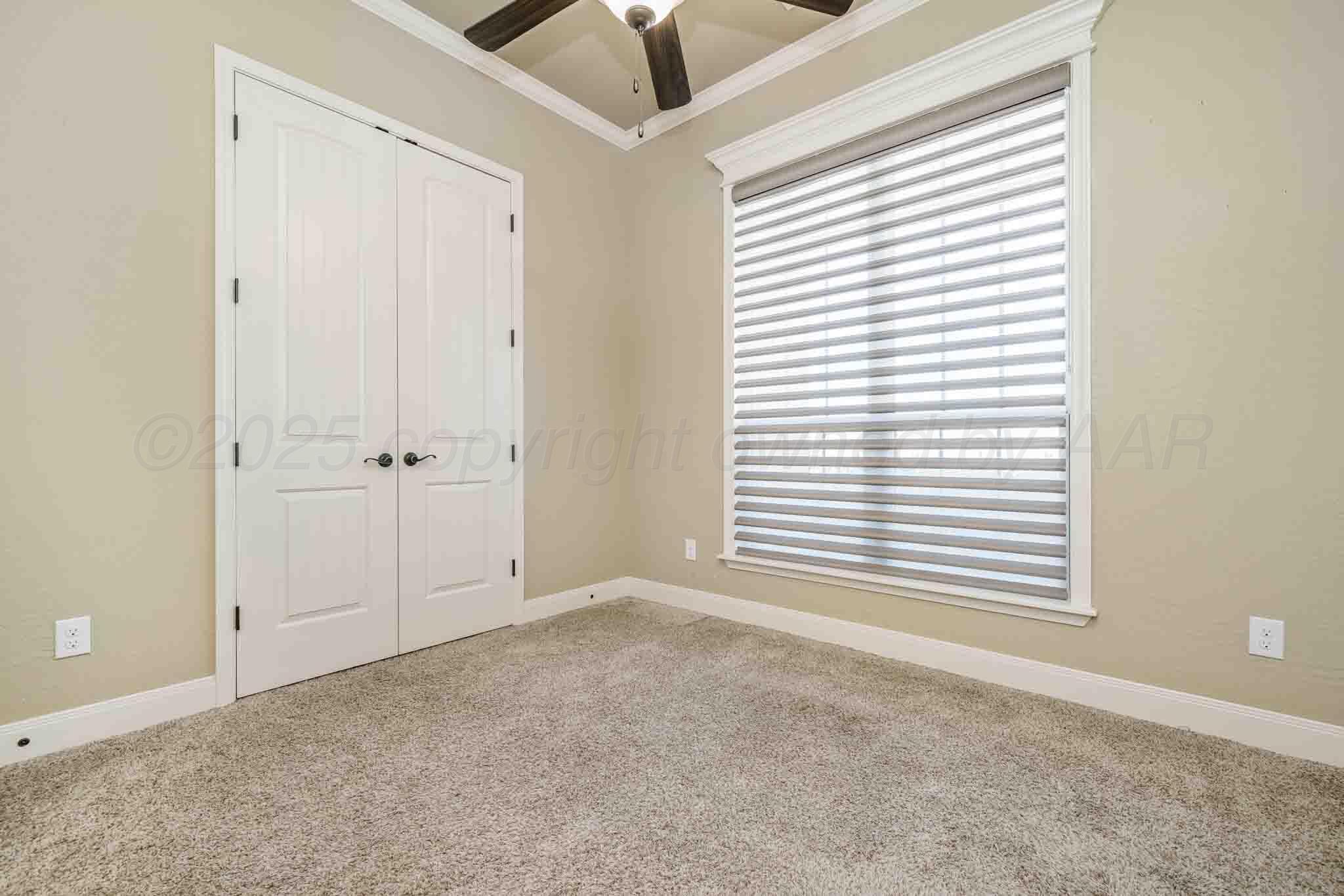 6 Cody Lane Canyon, TX 79015 - Photo 7 of 23 an empty room with a window and a ceiling fan