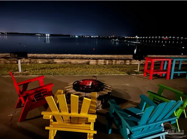 a view of a chairs and table in a patio