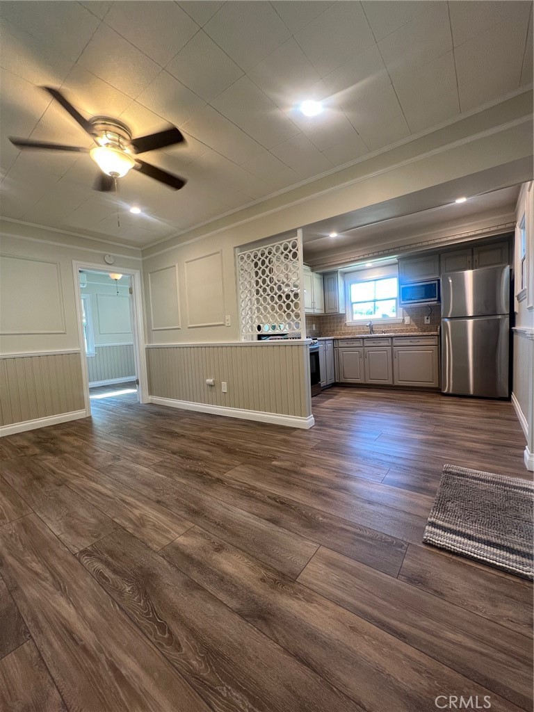 115 North Berkeley Avenue Fullerton, CA 92831 - Photo 2 of 14 an empty room with wooden floor and windows