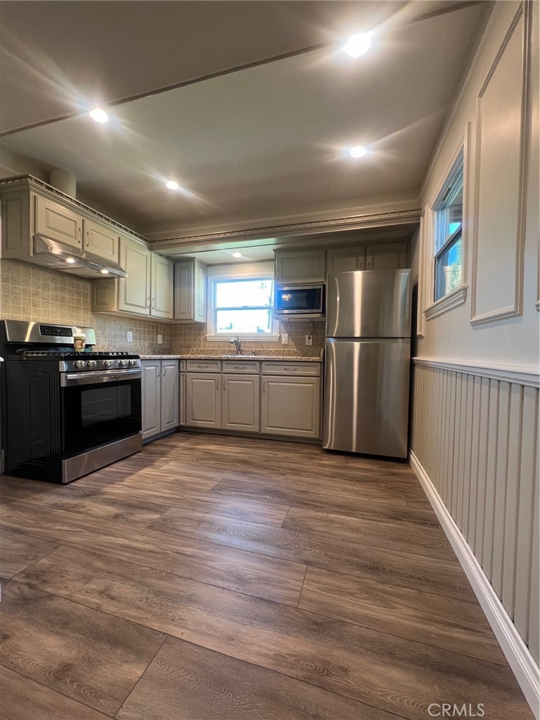 115 North Berkeley Avenue Fullerton, CA 92831 - Photo 3 of 14 a large kitchen with stainless steel appliances granite countertop a stove and a refrigerator