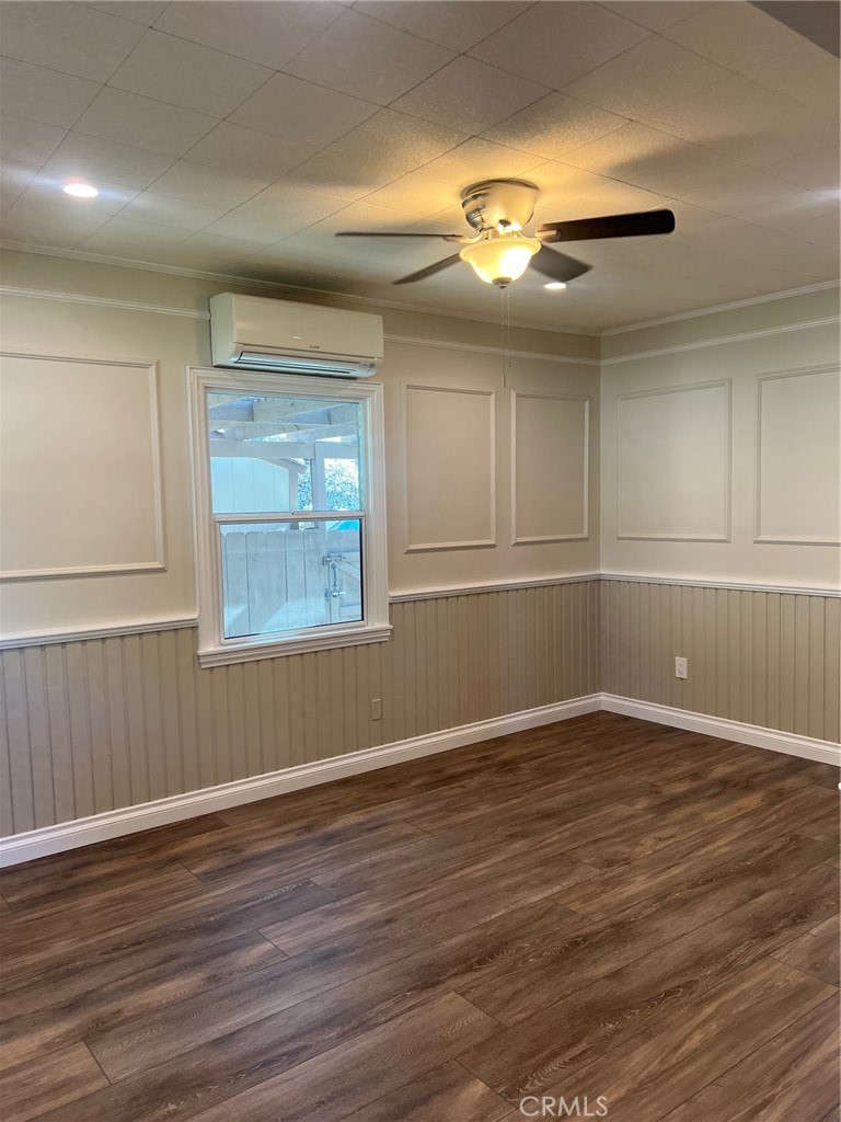 115 North Berkeley Avenue Fullerton, CA 92831 - Photo 5 of 14 an empty room with wooden floor and windows