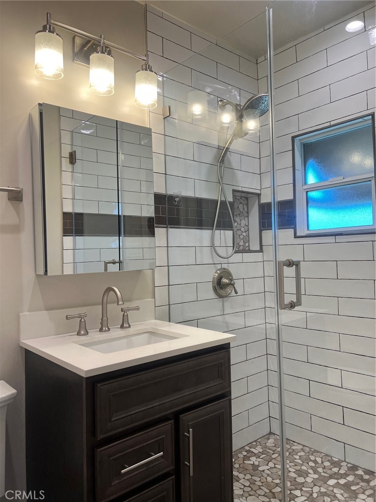 115 North Berkeley Avenue Fullerton, CA 92831 - Photo 7 of 14 a bathroom with a sink and a shower