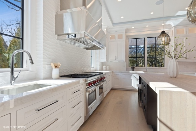 744 Taft Road Hinsdale, IL 60521 - Photo 12 of 37 a kitchen with a sink stove and cabinets
