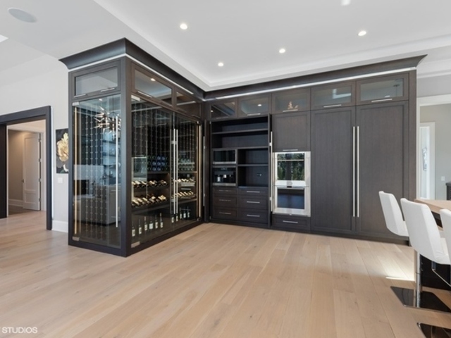 744 Taft Road Hinsdale, IL 60521 - Photo 15 of 37 a view of a hallway with wooden shelves