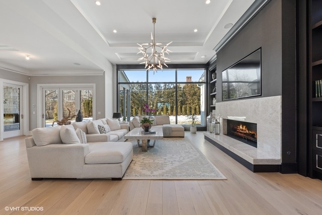 744 Taft Road Hinsdale, IL 60521 - Photo 17 of 37 a living room with furniture fireplace and flat screen tv