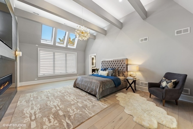 744 Taft Road Hinsdale, IL 60521 - Photo 24 of 37 a spacious bedroom with a bed and chair