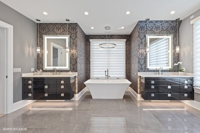 744 Taft Road Hinsdale, IL 60521 - Photo 26 of 37 a spacious bathroom with a tub sink and mirror