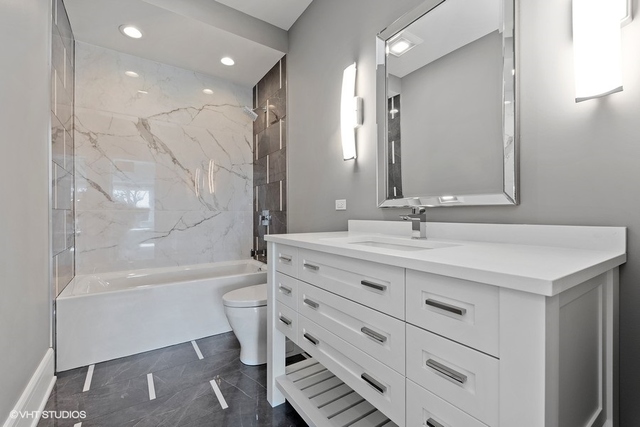 744 Taft Road Hinsdale, IL 60521 - Photo 30 of 37 a bathroom with a bathtub shower sink vanity and toilet