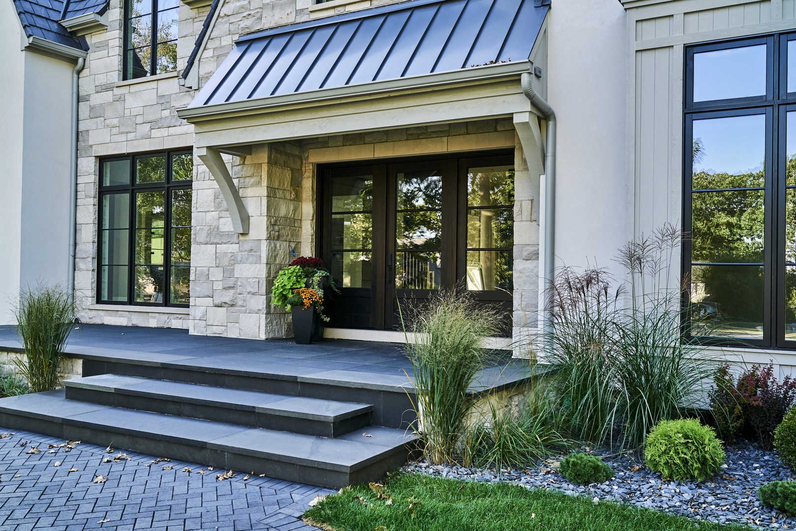 744 Taft Road Hinsdale, IL 60521 - Photo 5 of 37 a front view of a house with a plants and glass windows