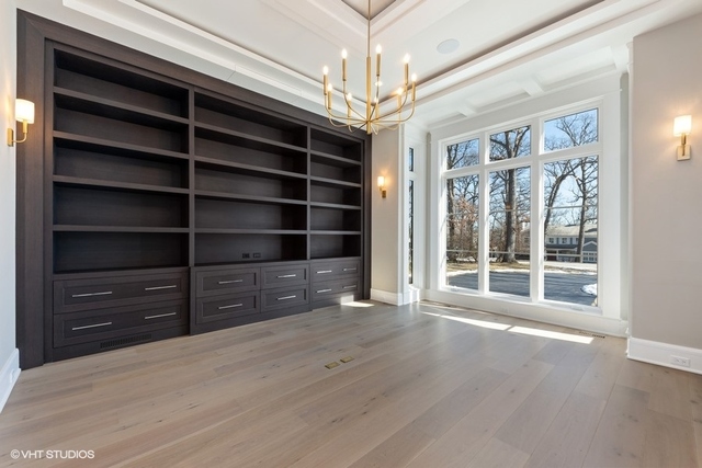 744 Taft Road Hinsdale, IL 60521 - Photo 7 of 37 a view of a room with wooden floor and windows