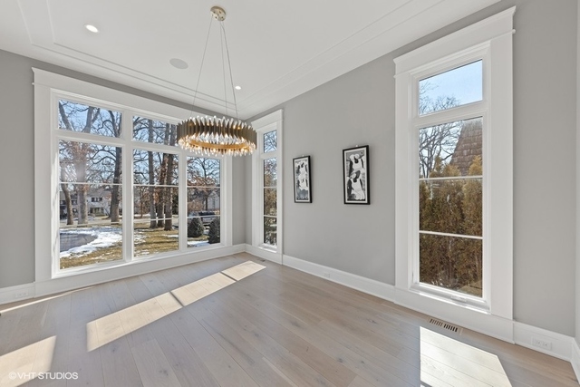 744 Taft Road Hinsdale, IL 60521 - Photo 8 of 37 a view of an empty room with a window and wooden floor