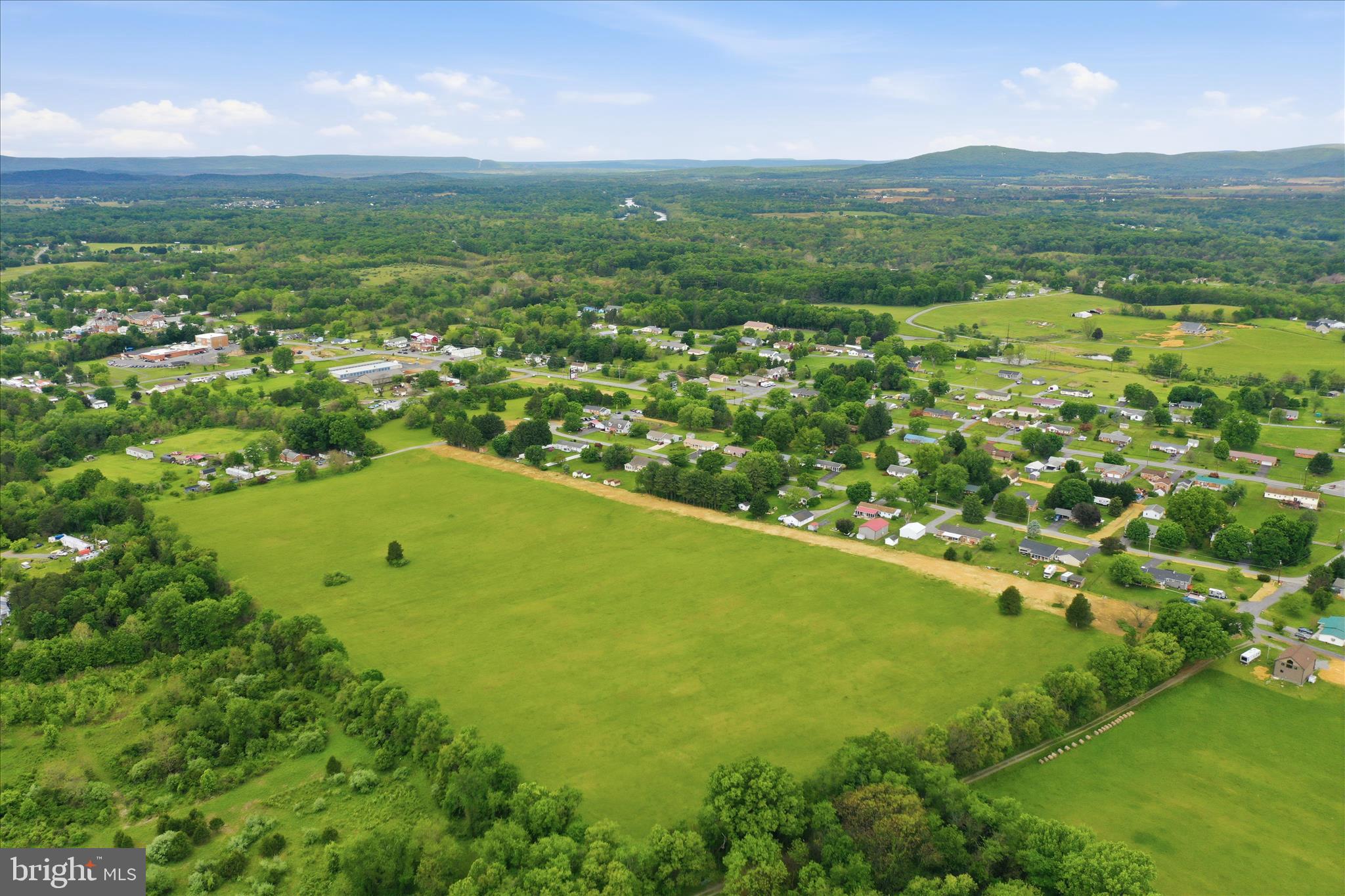 Murphy Lane Falling Waters, WV 25419 - Photo 12 of 16 a view of a green field with an ocean view
