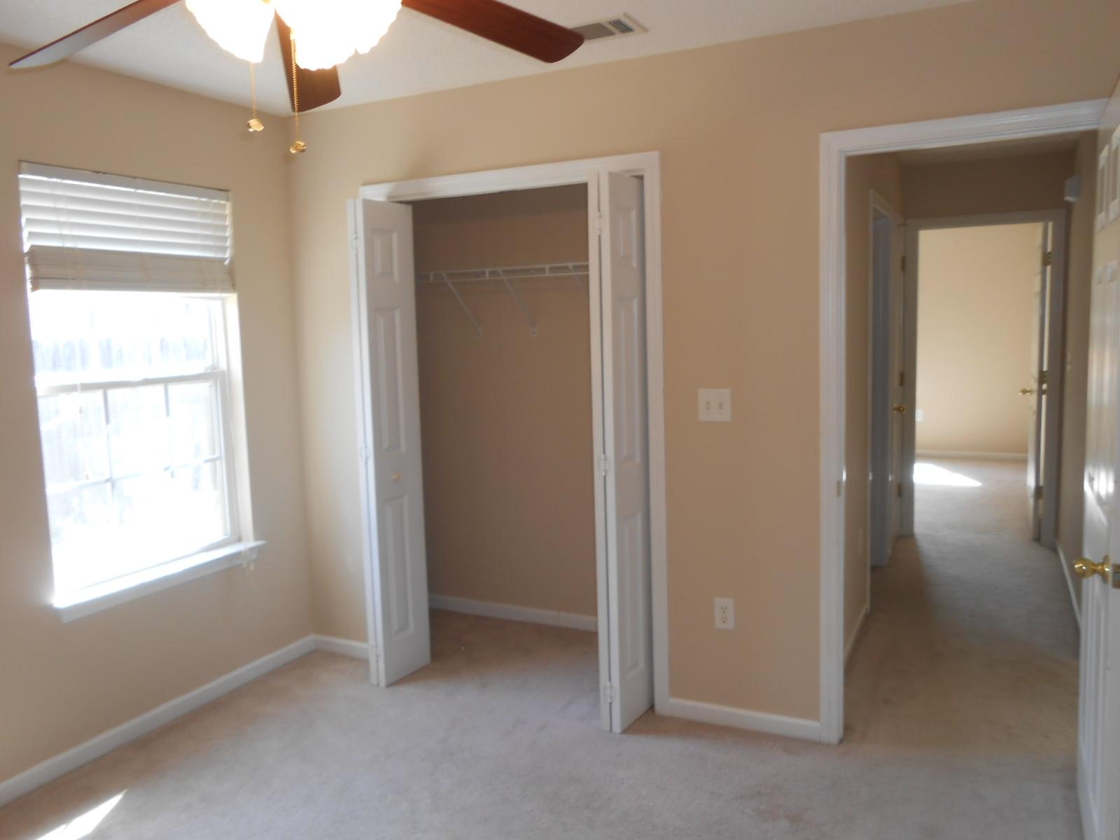 145 Laurel Lane DeFuniak Springs, FL 32433 - Photo 6 of 13 an empty room with windows and closet