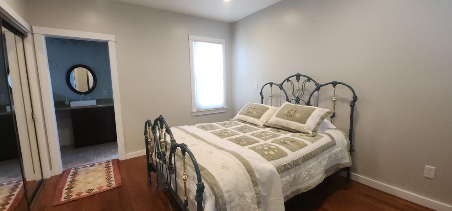690 Madison Street Santa Clara, CA 95050 - Photo 11 of 27 a bedroom with a bed and a window