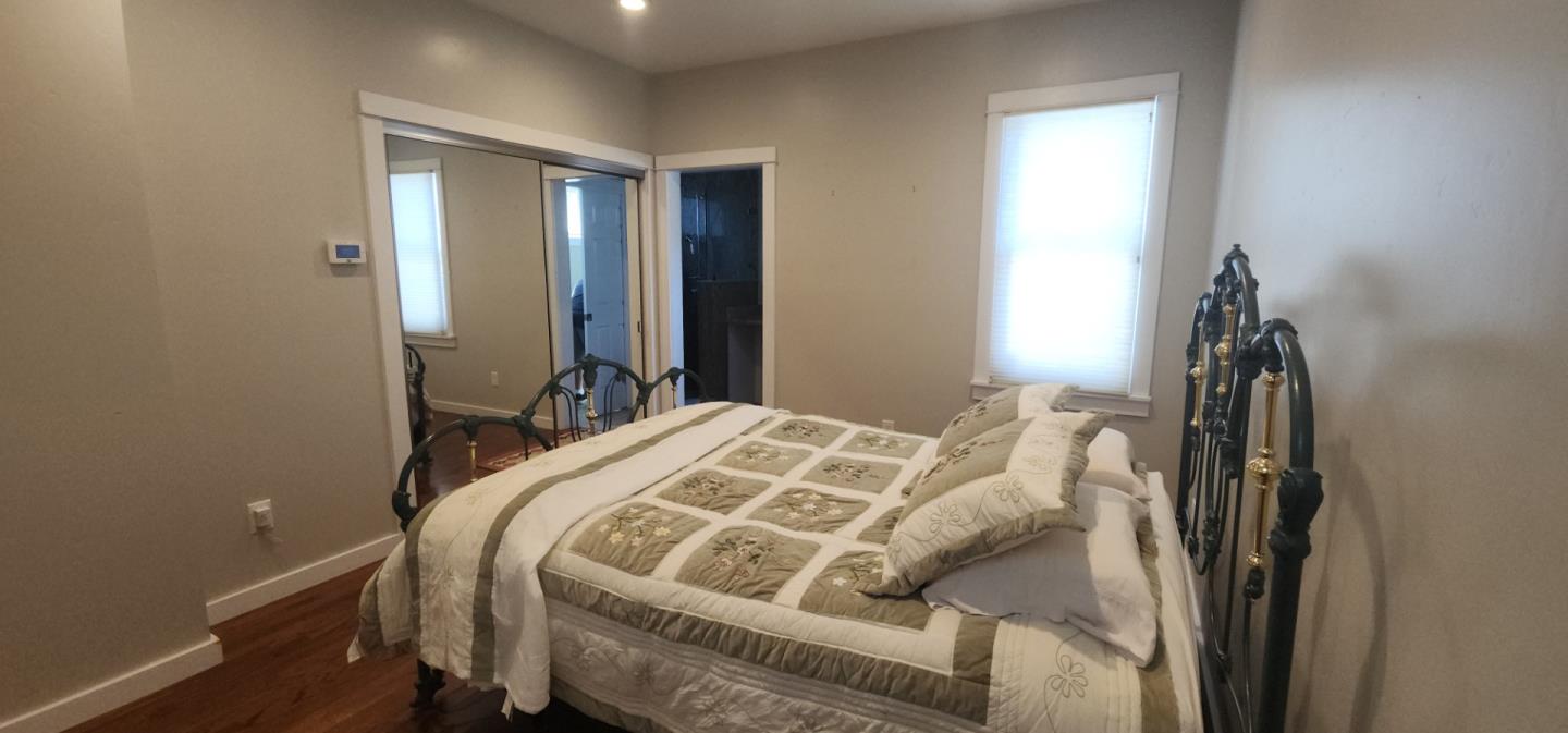 690 Madison Street Santa Clara, CA 95050 - Photo 12 of 27 a bedroom with a bed and a closet