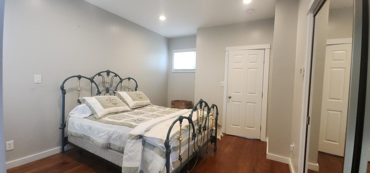 690 Madison Street Santa Clara, CA 95050 - Photo 13 of 27 a bedroom with a bed and a mirror