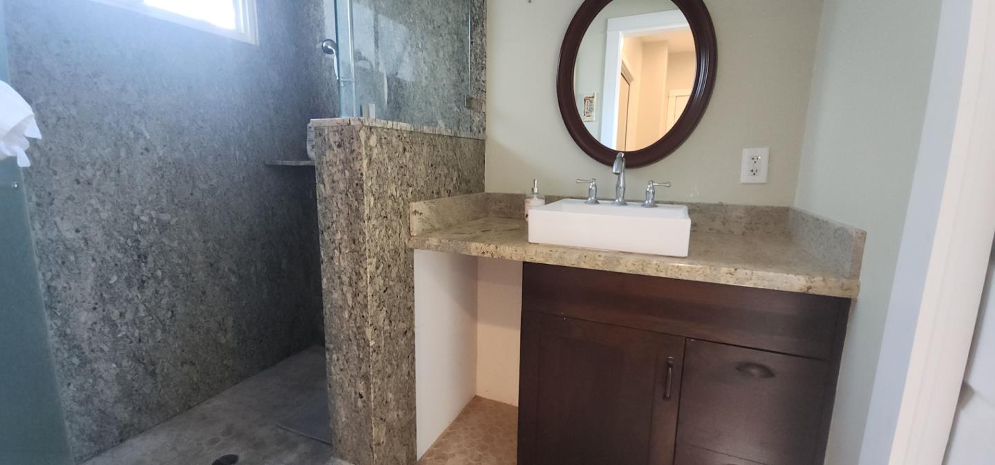 690 Madison Street Santa Clara, CA 95050 - Photo 14 of 27 a bathroom with a sink and a mirror