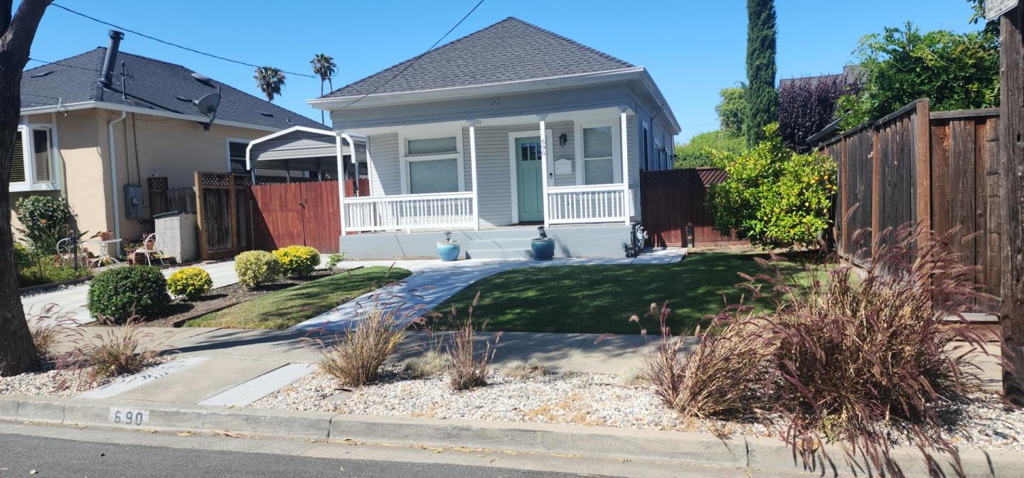 690 Madison Street Santa Clara, CA 95050 - Photo 2 of 27 a front view of a house with garden