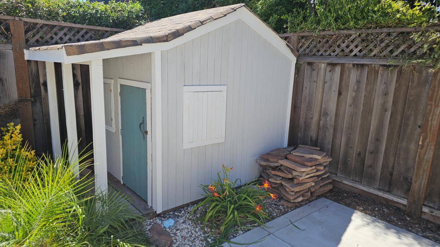690 Madison Street Santa Clara, CA 95050 - Photo 24 of 27 a view of a backyard with wooden fence