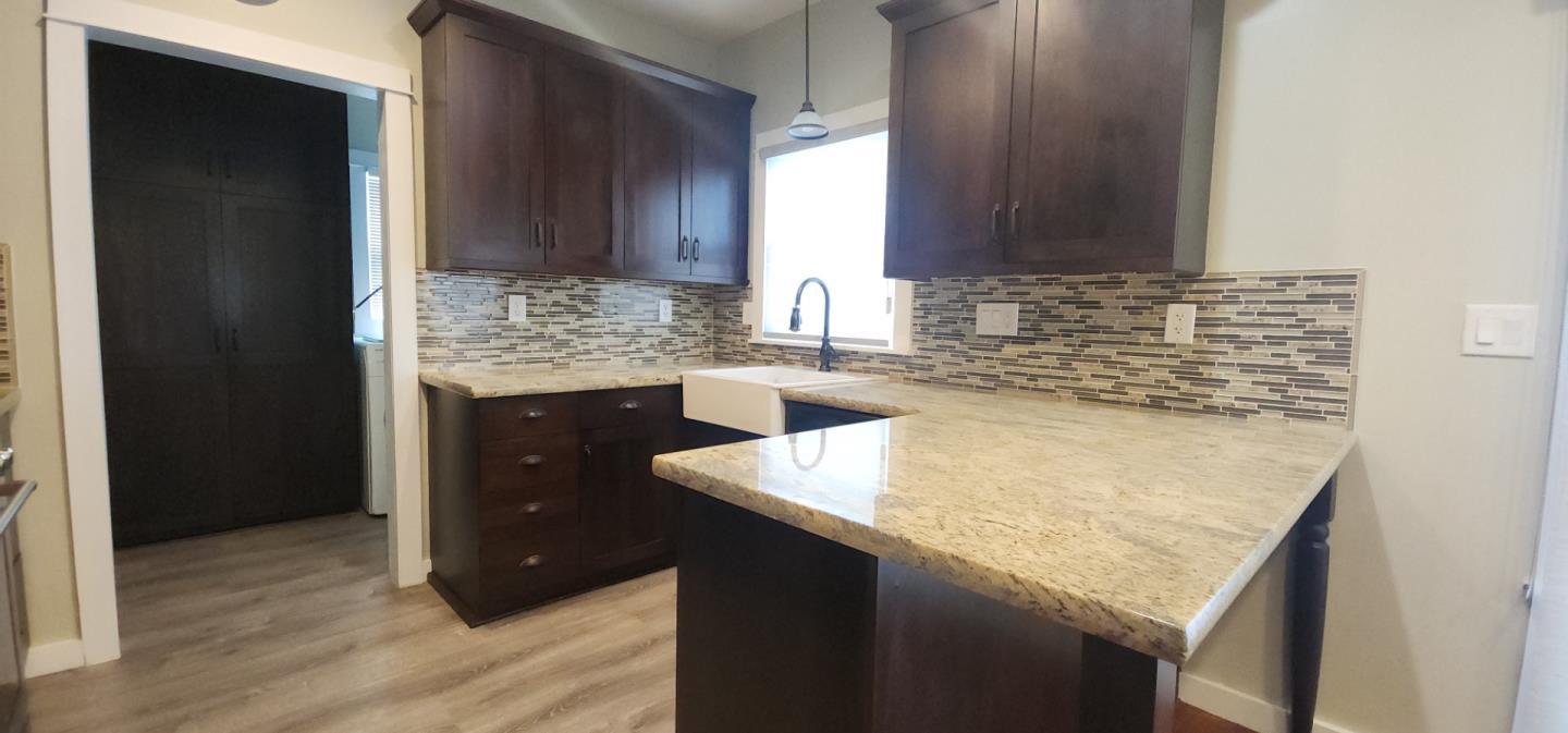 690 Madison Street Santa Clara, CA 95050 - Photo 7 of 27 a kitchen with a sink and cabinets
