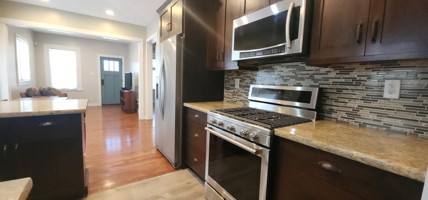 690 Madison Street Santa Clara, CA 95050 - Photo 10 of 27 a kitchen with a stove and a microwave