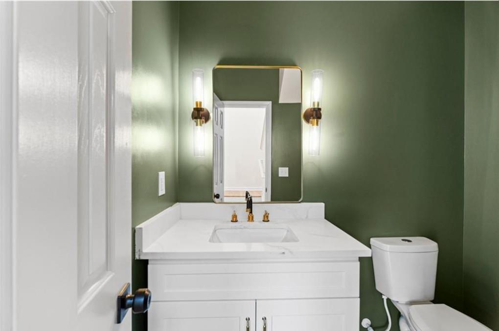 4095 Arch Pass Cumming, GA 30040 - Photo 12 of 31 a bathroom with a sink toilet and mirror