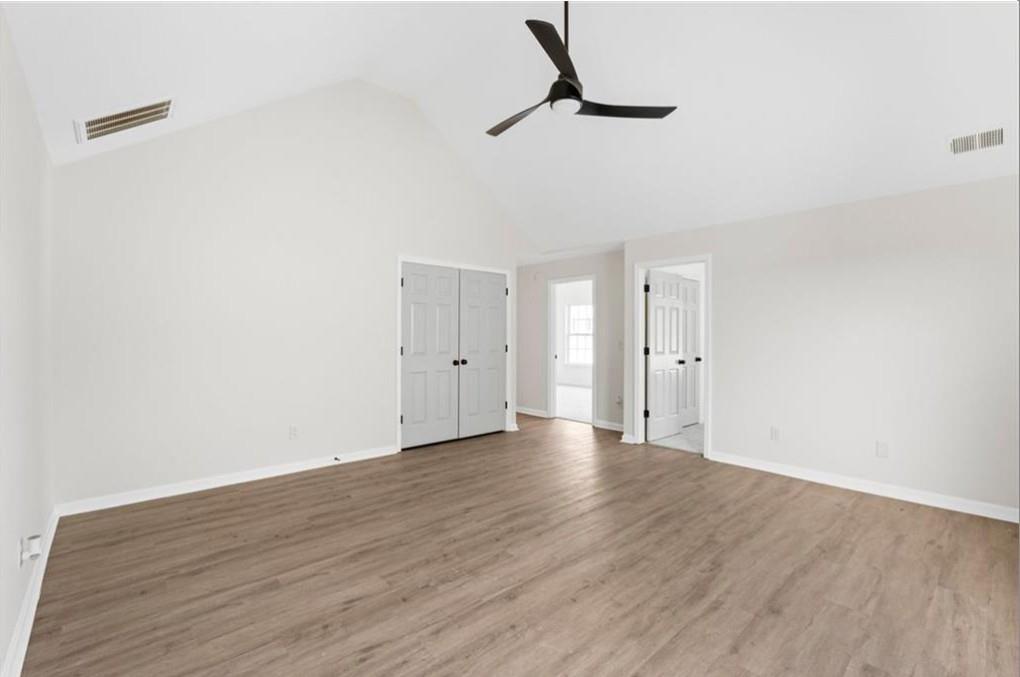4095 Arch Pass Cumming, GA 30040 - Photo 15 of 31 a view of empty room with wooden floor