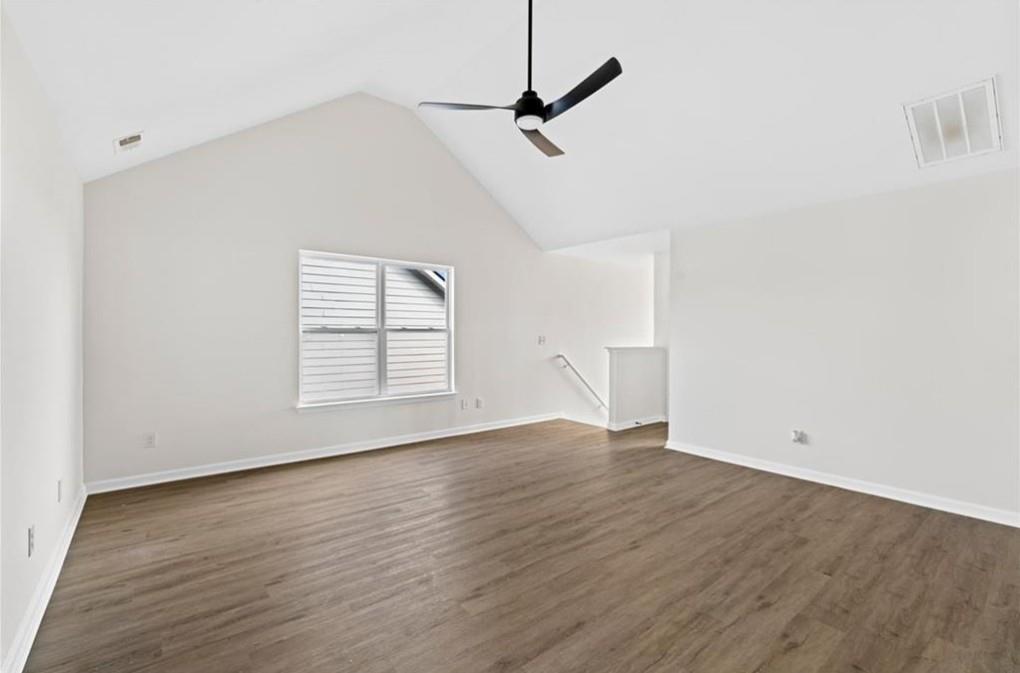 4095 Arch Pass Cumming, GA 30040 - Photo 16 of 31 a view of an empty room with wooden floor and a window