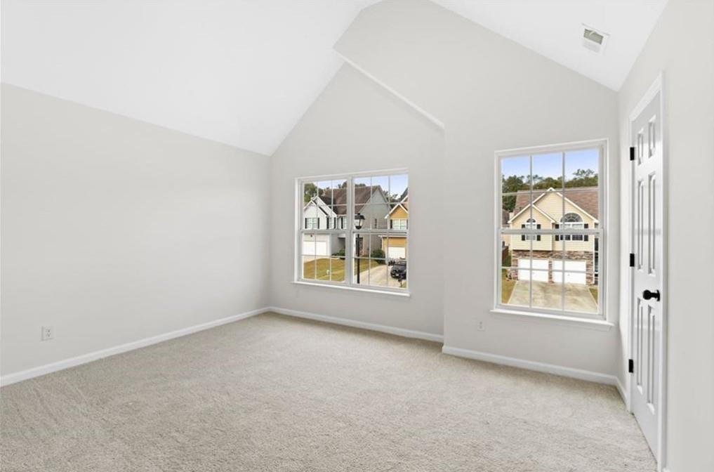 4095 Arch Pass Cumming, GA 30040 - Photo 19 of 31 an empty room with windows and closet