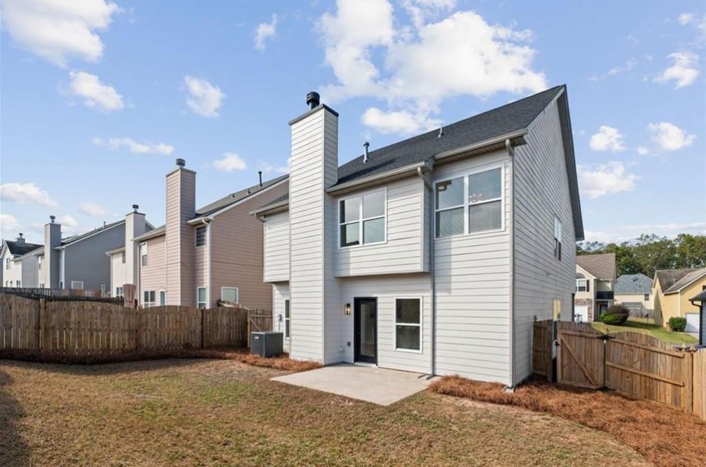 4095 Arch Pass Cumming, GA 30040 - Photo 28 of 31 a view of a house with a backyard and deck