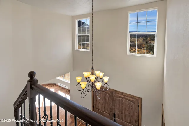 a vase of flowers sitting on a dining table