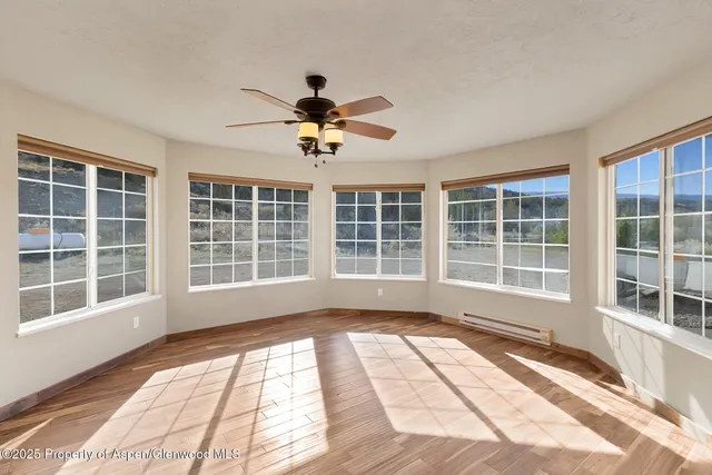 a view of a room with a large window