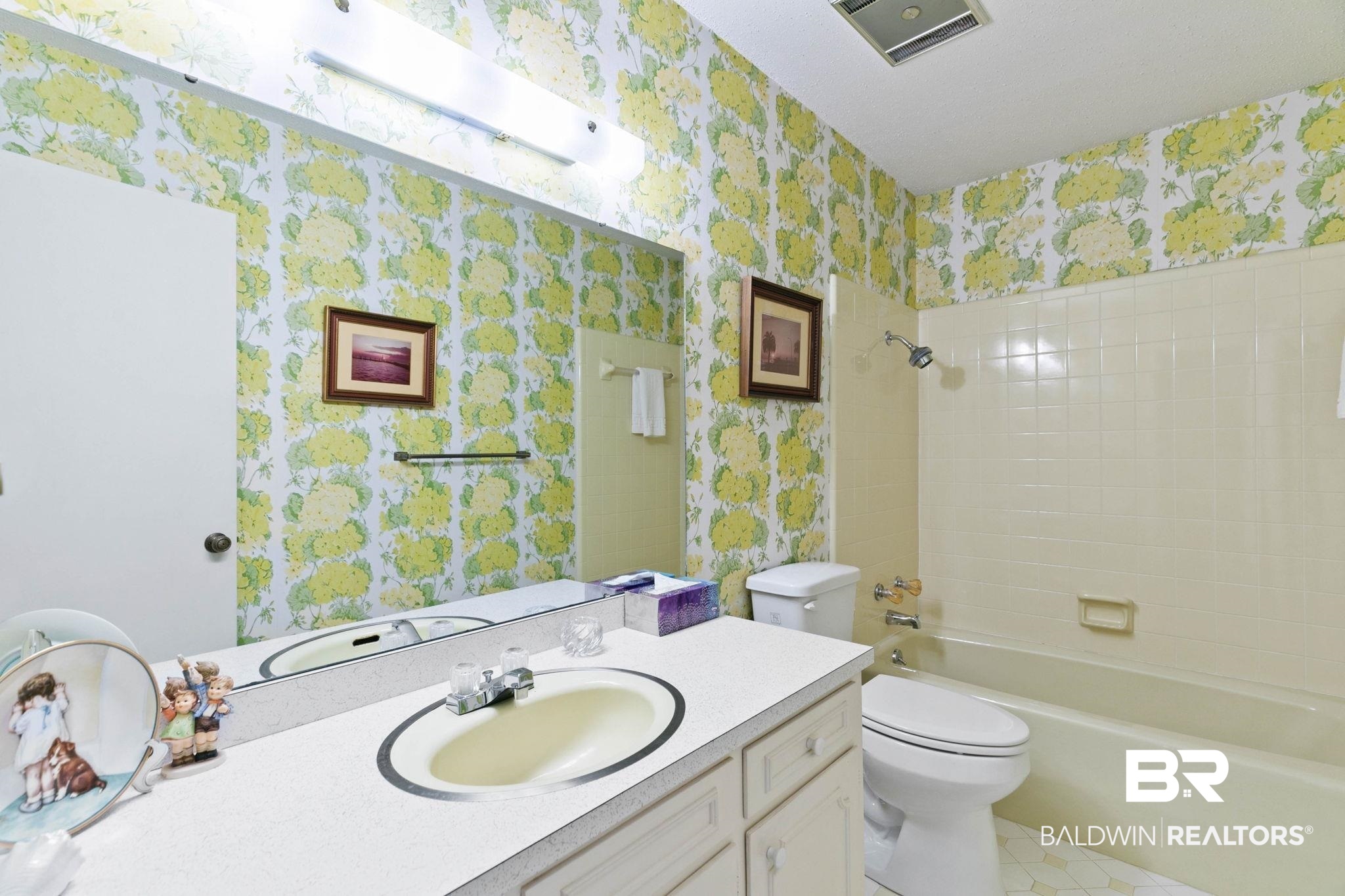 752 Evergreen Street Fairhope, AL 36532 - Photo 34 of 100 Bathroom with wallpapered walls, bathtub / shower combination, vanity, and light tile patterned floors