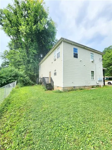 a view of a backyard with plants and a garden