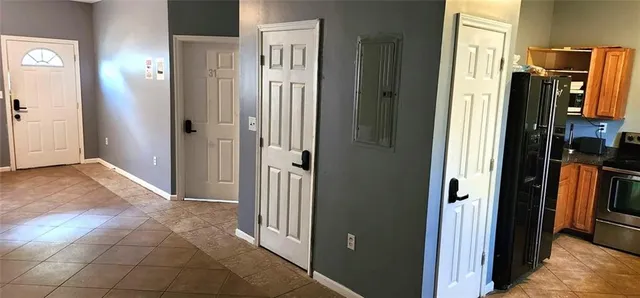 a view of a kitchen from the hallway