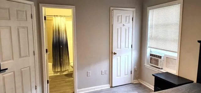 a view of front door with wooden floor